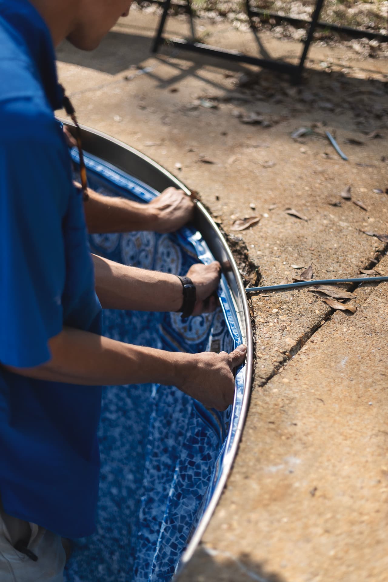Technician installing a pool liner
