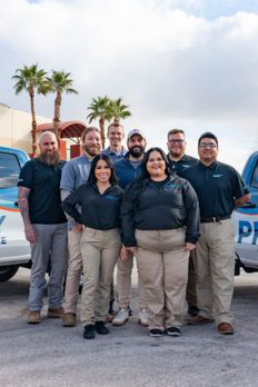 Pool service team in front of branded trucks